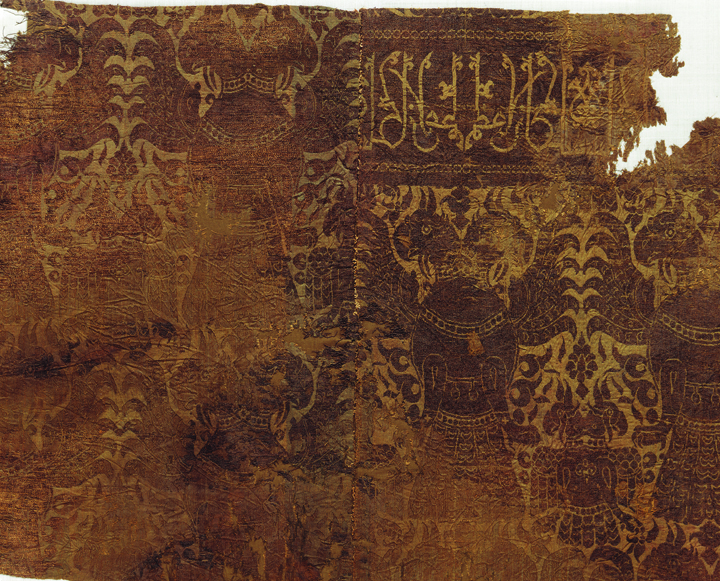 Figure 16. The horizontal band with an Arabic inscription on the double-headed eagle silk (detail of fig. 15). Abegg-Stiftung, Riggisberg, inv. nos. 5176, 5285, 5423. ©Abegg-Stiftung, CH-3132 Riggisberg, 2011. Photo by Christoph von Viràg Figure 16. The horizontal band with an Arabic inscription on the double-headed eagle silk (detail of fig. 15). Abegg-Stiftung, Riggisberg, inv. nos. 5176, 5285, 5423. ©Abegg-Stiftung, CH-3132 Riggisberg, 2011. Photo by Christoph von Viràg