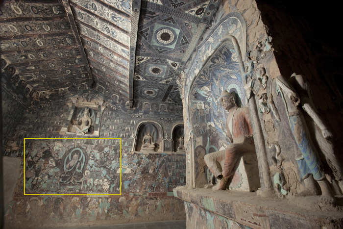 Alt-text: Richly painted interior of cave with Budhist wall paintings. A yellow box highlights a larger seated Buddhist figure with a greenish halo and surrounded by disciples. Alt-text: Richly painted interior of cave with Budhist wall paintings. A yellow box highlights a larger seated Buddhist figure with a greenish halo and surrounded by disciples.