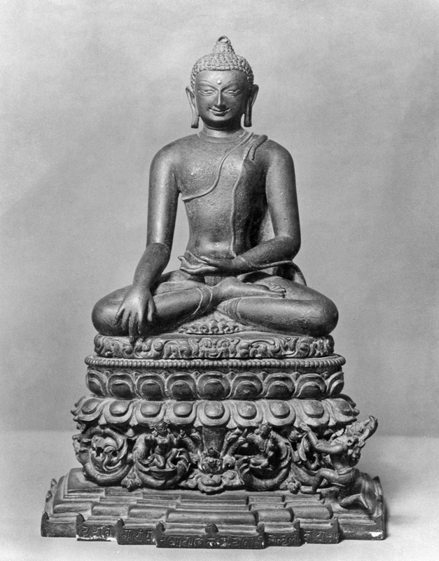 Alt-text: Buddha sculpture