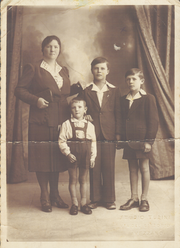 Alt-text: Portrait of woman and three boys