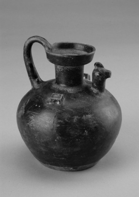 Chicken-headed ewer, Southeast China, Zhejiang or Jiangsu Province, Eastern Jin period (317–420).
Stoneware with black glaze, 17 x 13 x 12.6 cm.
Gift of Ping and Zenobia Lee, 2005/2.93
Chicken-headed ewer, Southeast China, Zhejiang or Jiangsu Province, Eastern Jin period (317–420).
Stoneware with black glaze, 17 x 13 x 12.6 cm.
Gift of Ping and Zenobia Lee, 2005/2.93