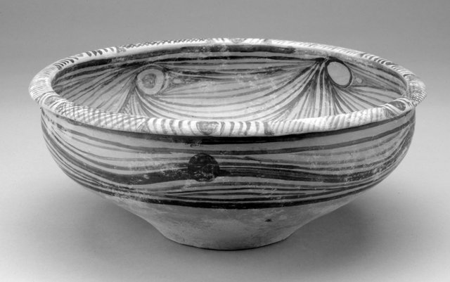 Shallow bowl with "flowing water" design, Neolithic Majiayao Culture, Majiayao Phase, 3200?2700 BCE.
Earthenware with black slip painted designs, 33 x 13 cm.
Gift of Jiu-Hwa Lo Upshur in memory of Mrs. Wei-Djen D. Lo, 2004/2.133 Shallow bowl with "flowing water" design, Neolithic Majiayao Culture, Majiayao Phase, 3200?2700 BCE.
Earthenware with black slip painted designs, 33 x 13 cm.
Gift of Jiu-Hwa Lo Upshur in memory of Mrs. Wei-Djen D. Lo, 2004/2.133