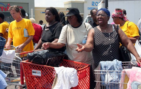 ©Associated Press - HURRICANE KATRINA EVACUEES FROM LOUISIANA LINE UP FOR DONATED CLOTHING AT A PARKING LOT ACROSS FROM THE ASTRODOME THURSDAY, SEPT. 1, 2005, IN HOUSTON. THE IMPROMPTU DONATION CENTER SPRANG UP AFTER PEOPLE WERE TURNED AWAY FROM THE SHELTER AT THE ASTRODOME. THE WOMEN DID NOT WISH TO BE IDENTIFIED. (AP PHOTO/PAT SULLIVAN) ©Associated Press - HURRICANE KATRINA EVACUEES FROM LOUISIANA LINE UP FOR DONATED CLOTHING AT A PARKING LOT ACROSS FROM THE ASTRODOME THURSDAY, SEPT. 1, 2005, IN HOUSTON. THE IMPROMPTU DONATION CENTER SPRANG UP AFTER PEOPLE WERE TURNED AWAY FROM THE SHELTER AT THE ASTRODOME. THE WOMEN DID NOT WISH TO BE IDENTIFIED. (AP PHOTO/PAT SULLIVAN)
