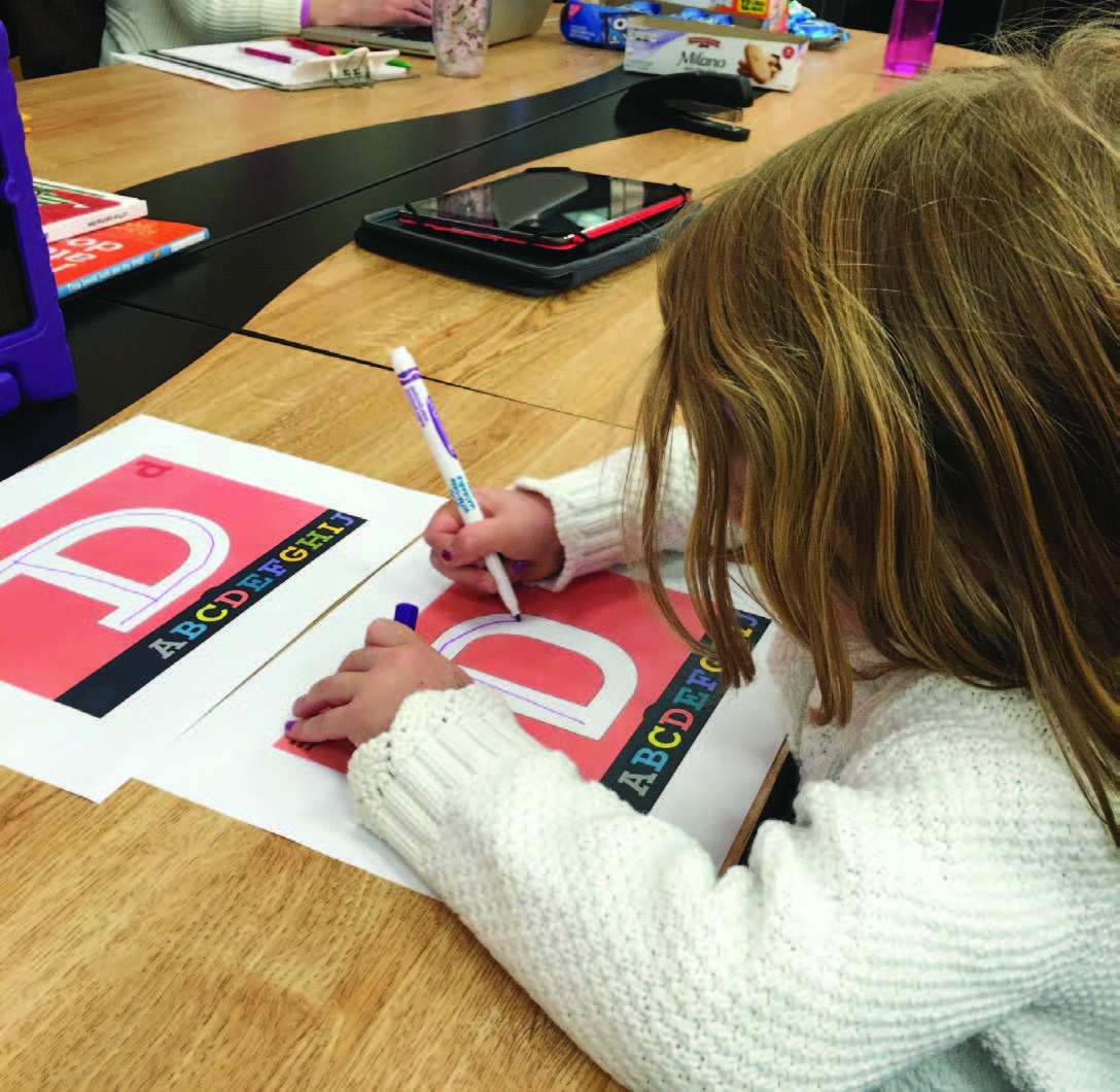 Figures 15: User Testing Documentation showing children tracing over early iterations using BioRhyme on an iPad and on paper (left) and tracing over different typefaces (right). Source: Rinnert, G. 2016. Figures 15: User Testing Documentation showing children tracing over early iterations using BioRhyme on an iPad and on paper (left) and tracing over different typefaces (right). Source: Rinnert, G. 2016.