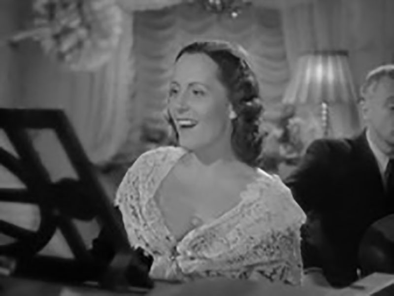 Figure 2. Novotná singing "Má hvězda" (“My Star”) during the flashback sequence. The song is also heard over the opening credits. Figure 2. Novotná singing "Má hvězda" (“My Star”) during the flashback sequence. The song is also heard over the opening credits.
