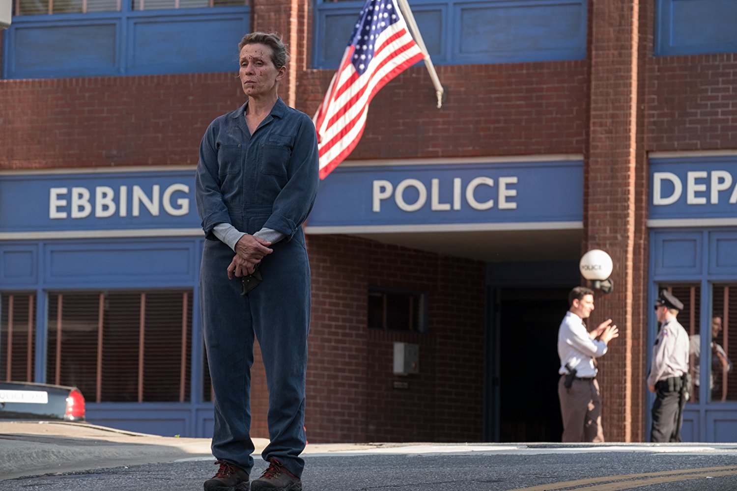 Figure 1: Mildred Hayes (Frances McDormand) stands alone, unable to convince the ineffectual police department to help her find closure regarding her daughter’s murder in Three Billboards Outside Ebbing, Missouri. Figure 1: Mildred Hayes (Frances McDormand) stands alone, unable to convince the ineffectual police department to help her find closure regarding her daughter’s murder in Three Billboards Outside Ebbing, Missouri.