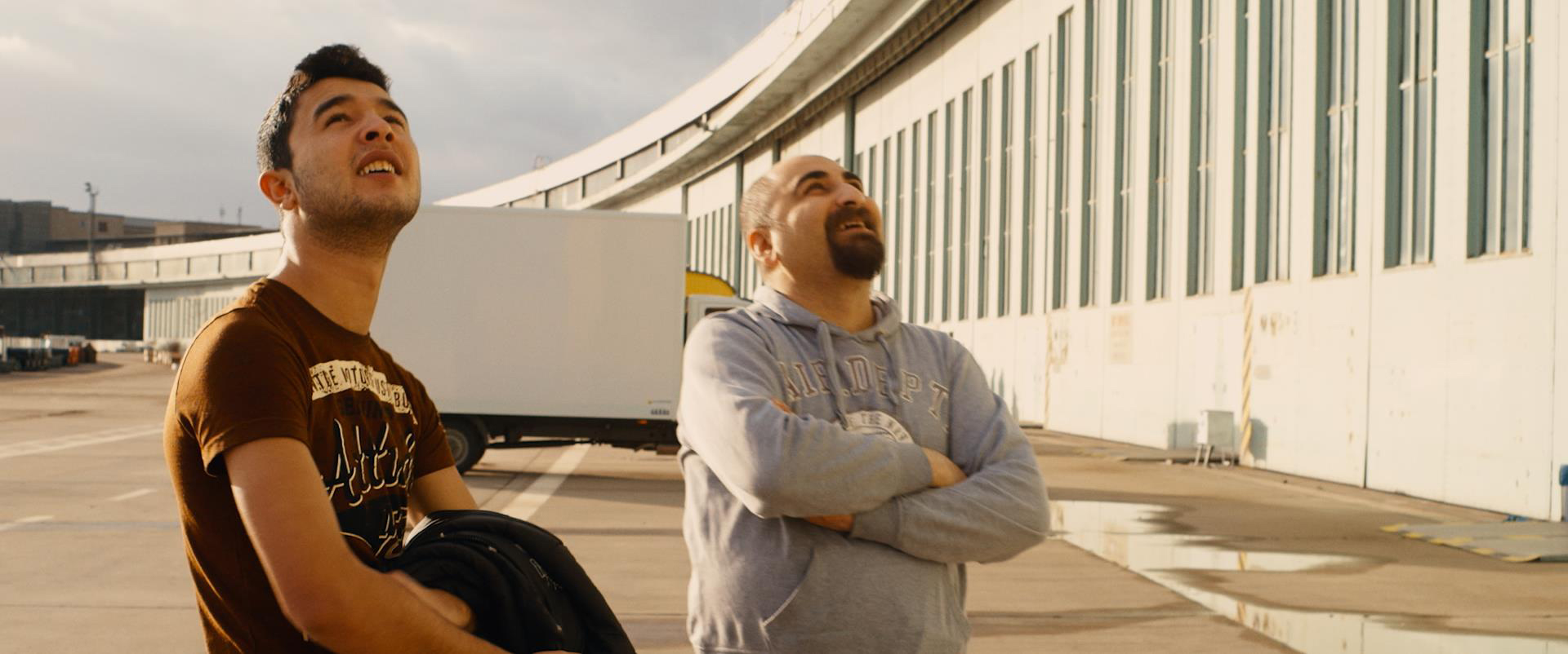 Figure 4: Ibrahim and Qutaiba feel a sense of home at Tempelhof airfield in Karim Aïnouz’ Central Airport THF. Figure 4: Ibrahim and Qutaiba feel a sense of home at Tempelhof airfield in Karim Aïnouz’ Central Airport THF.