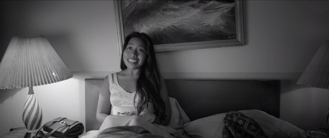 Figure 6: Cleo (Yalitza Aparicio) conveys her devotion to her boyfriend, Fermin (Jorge Antonio Guerrero) , as he entertains her in their hotel room. Figure 6: Cleo (Yalitza Aparicio) conveys her devotion to her boyfriend, Fermin (Jorge Antonio Guerrero) , as he entertains her in their hotel room.