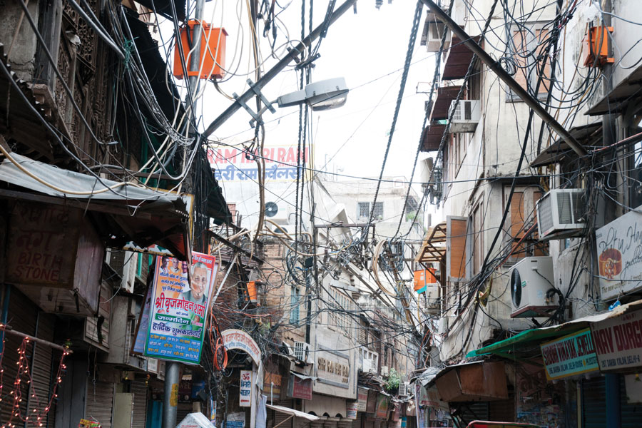 Figure 2.: Risky and chaotic electrical wiring in Old Delhi, India. The unsatisfying condition of wiring causes power problems in Delhi. Figure 2.: Risky and chaotic electrical wiring in Old Delhi, India. The unsatisfying condition of wiring causes power problems in Delhi.