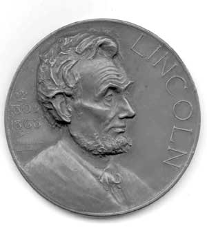 Figure 1a. The Illinois Watch Company of Springfield, Illinois,
distributed thousands of medals in its Lincoln essay contest,
beginning in 1924. The medal, cast in bronze, measures about three
inches in diameter, large enough to be called a medallion.
Figure 1a. The Illinois Watch Company of Springfield, Illinois,
distributed thousands of medals in its Lincoln essay contest,
beginning in 1924. The medal, cast in bronze, measures about three
inches in diameter, large enough to be called a medallion.