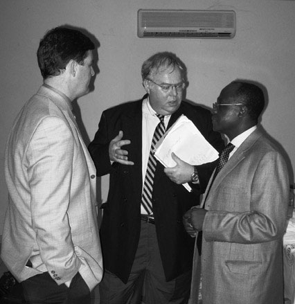 U-M Professor Tim Johnson and Ted Hanss talk with Professor Peter Donkor, Provost, College of Health Sciences at Kwame Nkrumah University of Science & Technology (KNUST), in Kumasi. VINCENT DUFFY U-M Professor Tim Johnson and Ted Hanss talk with Professor Peter Donkor, Provost, College of Health Sciences at Kwame Nkrumah University of Science & Technology (KNUST), in Kumasi. VINCENT DUFFY
