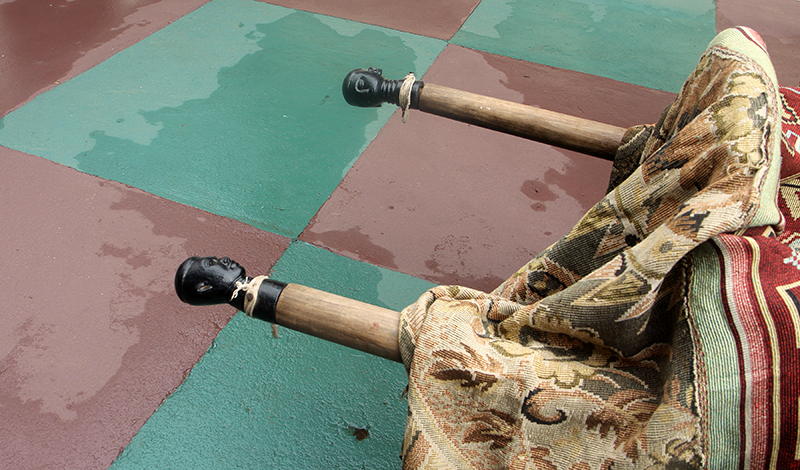 Description: The ntuatire of the carrying poles are known as Bampo Ti (Bampo’s Head). As we say in Twi, Ne ti ne ne kɔn ɛtesɛ Bampo (his head and neck are like that of Bampo). Bampo was a defeated adversary from Ayaase (Denkyira) who was known to be tall and muscular. After his defeat, the king asked his carvers to carve a replica of his head and afix it on the Apakan pole. Description: The ntuatire of the carrying poles are known as Bampo Ti (Bampo’s Head). As we say in Twi, Ne ti ne ne kɔn ɛtesɛ Bampo (his head and neck are like that of Bampo). Bampo was a defeated adversary from Ayaase (Denkyira) who was known to be tall and muscular. After his defeat, the king asked his carvers to carve a replica of his head and afix it on the Apakan pole.
