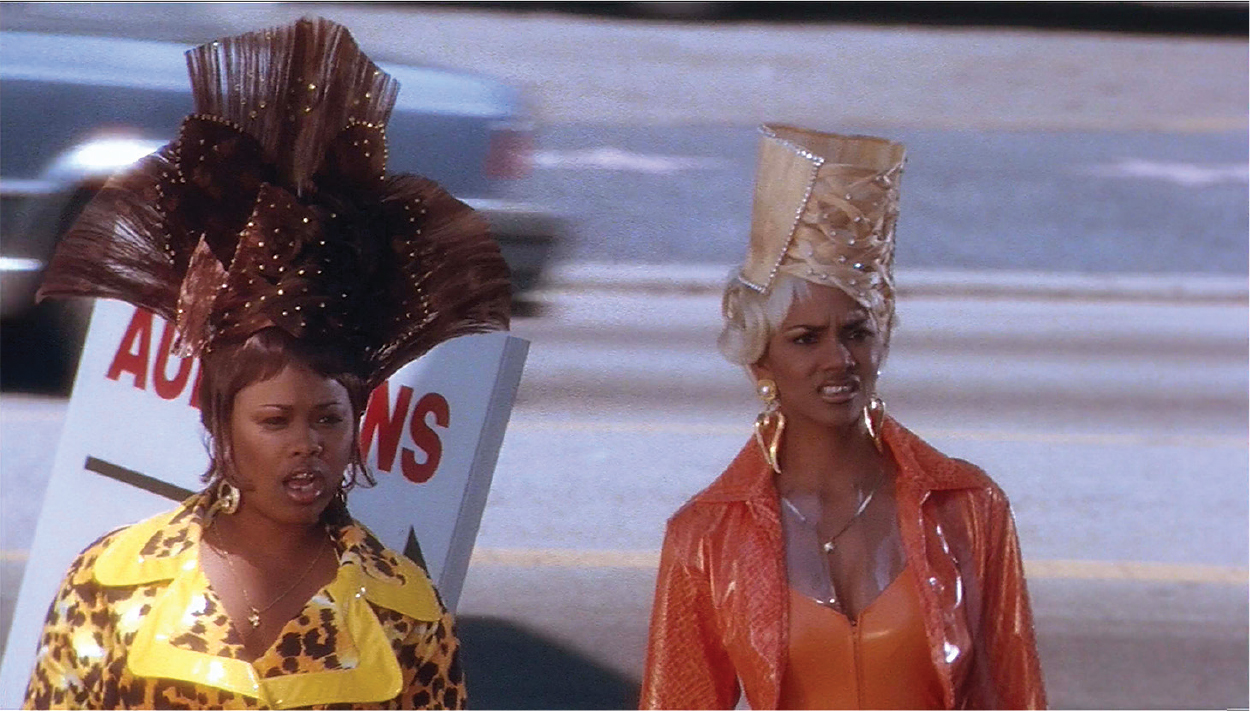 Figure 1. Natalie Desselle (left) and Halle Berry (right) in B.A.P.S. (1997). Hair by Kim Kimble and costumes by Ruth Carter. Figure 1. Natalie Desselle (left) and Halle Berry (right) in B.A.P.S. (1997). Hair by Kim Kimble and costumes by Ruth Carter.
