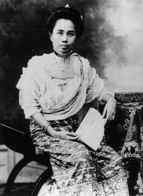 Figure 28. Recently promoted to the rank of High Queen [พระราชชายา], Dara Rasami poses for a formal portrait in her hometown, Chiang Mai. Note that she wears a phasin [skirt] made from a Burmese court textile called luntaya. (Probably taken at the Chiang Mai studio of Japanese photographer S. Tanaka, 1909.)