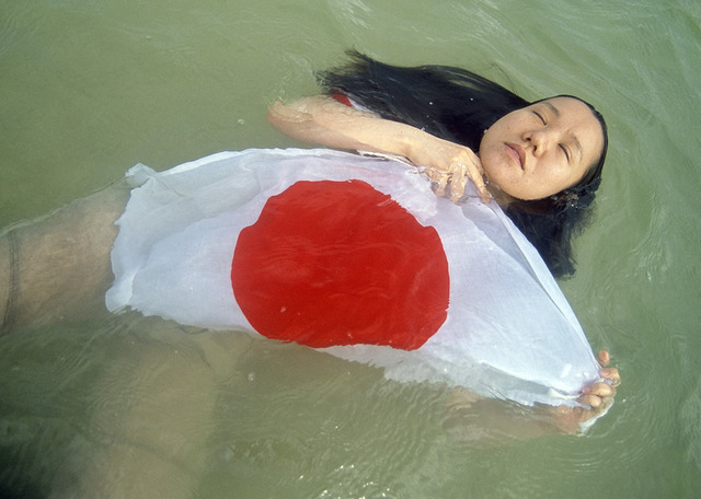 Mao Ishikawa, “Ms. Wakana Ohshiro (26) A student of a drama school June 8, 2008, in Nago City, Okinawa”, from the series Here Is What the Japanese Flag Means to Me, ©Mao Ishikawa. Mao Ishikawa, “Ms. Wakana Ohshiro (26) A student of a drama school June 8, 2008, in Nago City, Okinawa”, from the series Here Is What the Japanese Flag Means to Me, ©Mao Ishikawa.