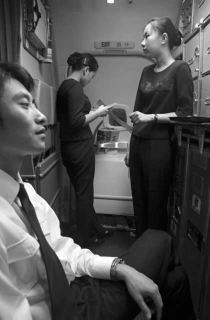 Wang Lin, “Resting and reading papers on board flight Changsha-Kunming”, from Heaven & Earth series, 2007, 50x40cm. Wang Lin, “Resting and reading papers on board flight Changsha-Kunming”, from Heaven & Earth series, 2007, 50x40cm.