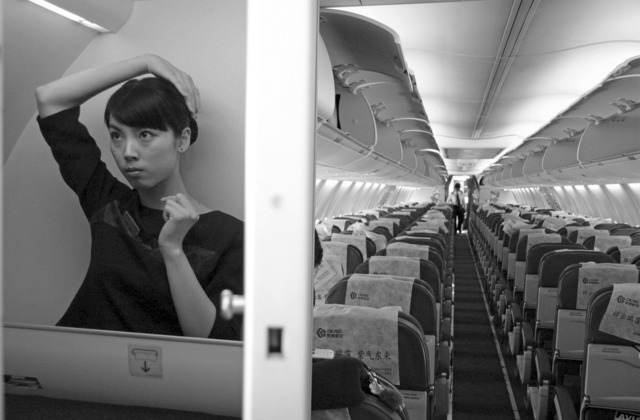 Wang Lin, “Waiting for passengers to board the flight from Tianjin-Changsha”, from Heaven & Earth series, 2008, 40x50cm. Wang Lin, “Waiting for passengers to board the flight from Tianjin-Changsha”, from Heaven & Earth series, 2008, 40x50cm.