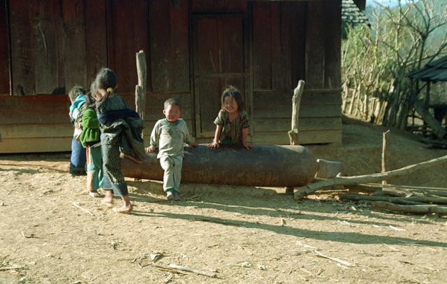 Fig. 2.7: Children around bomb casing used for watering animals. 