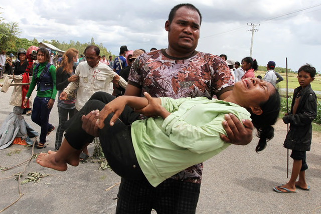 Sovan Philong, ‘Violent Scenes in a Rice Paddy 11’, 2009. Digital C-Print. Courtesy the artist and Asia Motion. Sovan Philong, ‘Violent Scenes in a Rice Paddy 11’, 2009. Digital C-Print. Courtesy the artist and Asia Motion.