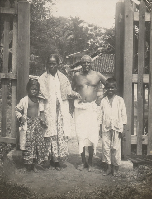Fig. 8. Indian family poses by their compound gate, early 1900s, from the Edwin A Brown Collection. (All rights reserved, Celia Mary Ferguson and National Library Board, Singapore 2008) Fig. 8. Indian family poses by their compound gate, early 1900s, from the Edwin A Brown Collection. (All rights reserved, Celia Mary Ferguson and National Library Board, Singapore 2008)