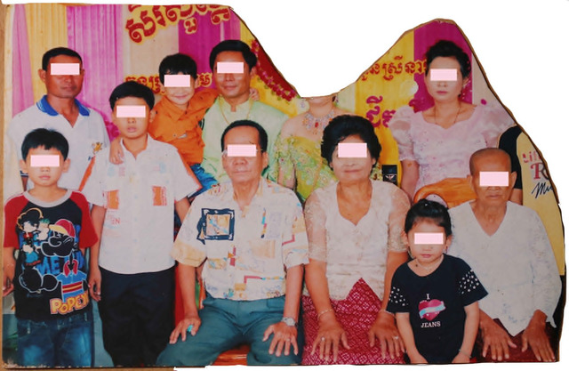 Fig. 8. A wedding photograph from a family album of grandfather “Aspara” taken in the early 2000s in Battambang province, North-western Cambodia. His daughter-in-law was cut out of the photograph when he realised that she communicated HIV to his son. Although both of them passed away, the grandfather felt the need to express his anger by excising the ex-daughter-in-law as if the abolition of her face would also destroy her soul. This analogue mode of deletion prefigures Photoshop, and Facebook’s era of “friend” and “un-friend”. Re-photographed by Sokphea Young. Fig. 8. A wedding photograph from a family album of grandfather “Aspara” taken in the early 2000s in Battambang province, North-western Cambodia. His daughter-in-law was cut out of the photograph when he realised that she communicated HIV to his son. Although both of them passed away, the grandfather felt the need to express his anger by excising the ex-daughter-in-law as if the abolition of her face would also destroy her soul. This analogue mode of deletion prefigures Photoshop, and Facebook’s era of “friend” and “un-friend”. Re-photographed by Sokphea Young.