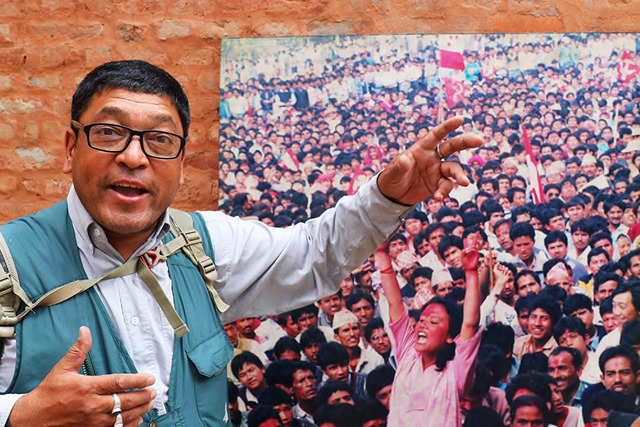 Fig. 11. The photographer Min Ratna Bajracharya with his image “Dawn of Freedom,” Kathmandu, September 2019. Following the shooting dead of more than fifty demonstrators, in April 1990, King Birendra announced the end of absolute rule. Bajracharya photographed a young woman named Durga Thapa rising from a large, predominantly male celebratory crowd with her hands raised in a victory salute. This jubilant image would become an icon of Nepali photojournalism, but one that is little known outside of the country. Durga Thapa’s pose is regularly (re-)performed by demonstrators: Bajracharya recounts many instances in which he subsequently photographed activists consciously acting out her iconic gestures. Photograph by Christopher Pinney. Fig. 11. The photographer Min Ratna Bajracharya with his image “Dawn of Freedom,” Kathmandu, September 2019. Following the shooting dead of more than fifty demonstrators, in April 1990, King Birendra announced the end of absolute rule. Bajracharya photographed a young woman named Durga Thapa rising from a large, predominantly male celebratory crowd with her hands raised in a victory salute. This jubilant image would become an icon of Nepali photojournalism, but one that is little known outside of the country. Durga Thapa’s pose is regularly (re-)performed by demonstrators: Bajracharya recounts many instances in which he subsequently photographed activists consciously acting out her iconic gestures. Photograph by Christopher Pinney.
