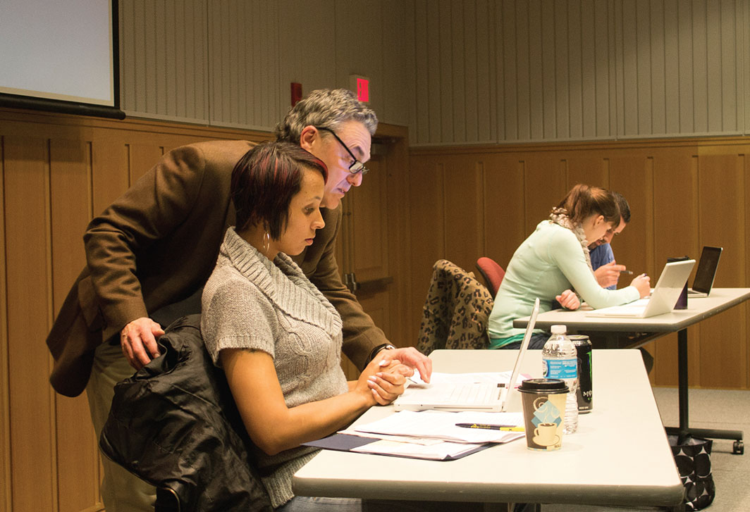Figure 1. In the Foreground, Carpenter (Loren Bass) Invades Kiana’s (Helki Jackson) Personal Space. In the Background, Courtney (Rochelle Clark) and Joel (Matios Simonian) Work on a Project Unaware of Their Labmate’s Discomfort. (Photo taken by Pamela Fisher and reprinted with permission.) Figure 1. In the Foreground, Carpenter (Loren Bass) Invades Kiana’s (Helki Jackson) Personal Space. In the Background, Courtney (Rochelle Clark) and Joel (Matios Simonian) Work on a Project Unaware of Their Labmate’s Discomfort. (Photo taken by Pamela Fisher and reprinted with permission.)